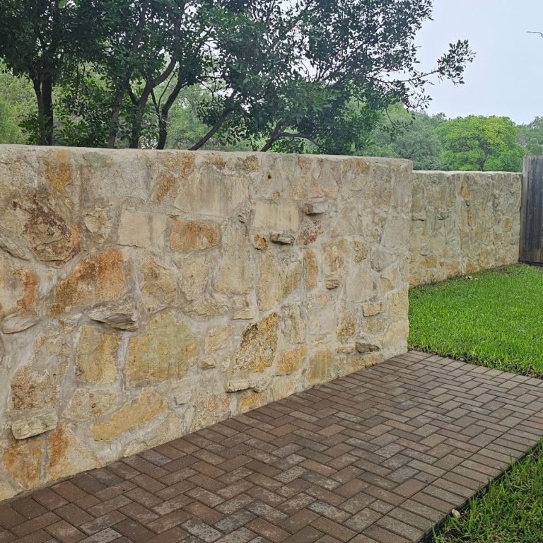Cleaned long driveway Before and after view of a driveway, showcasing a clean, smooth surface and surrounding greenery.